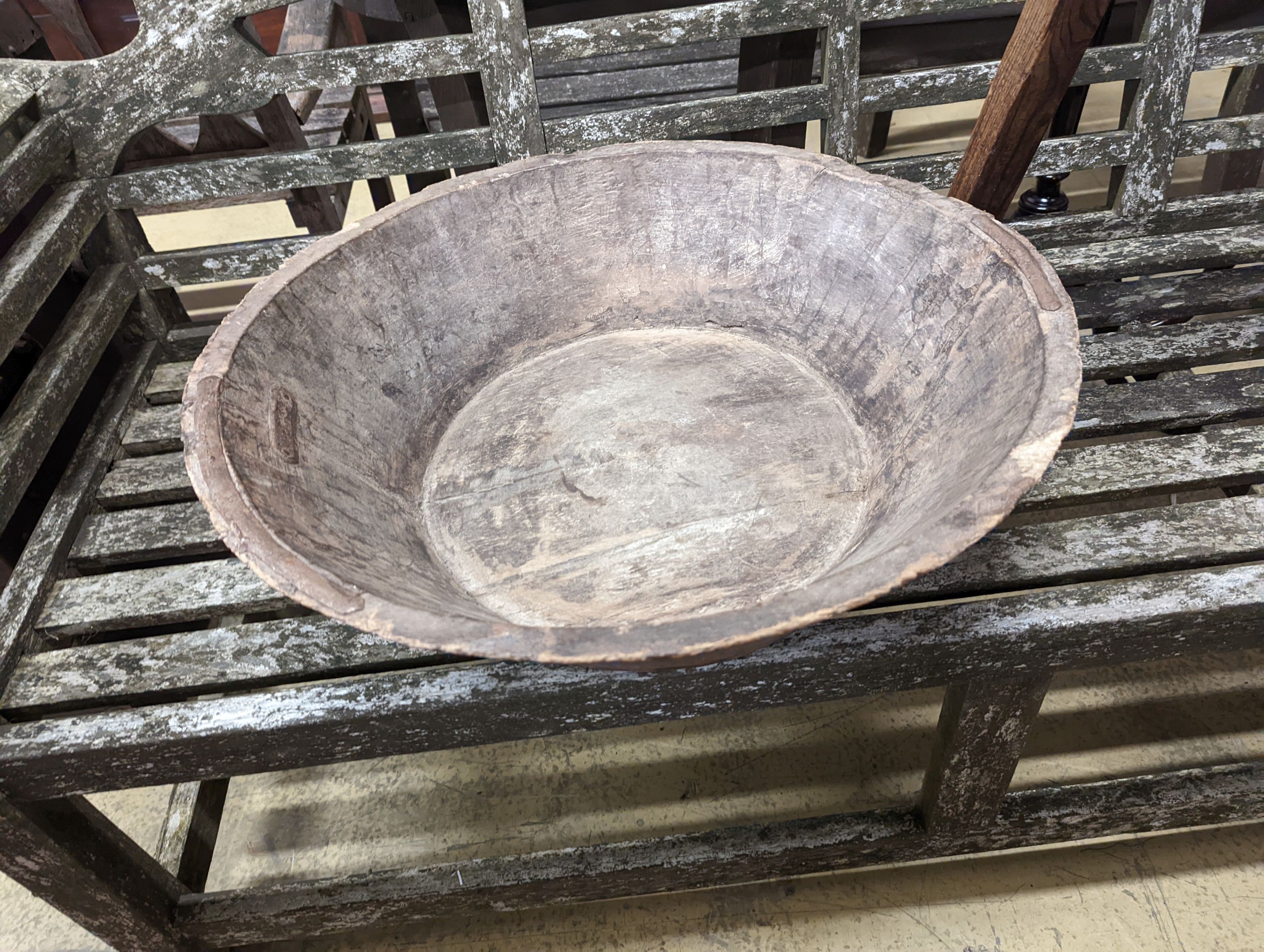 A provincial elm and fruitwood D shaped stool together with a circular iron mounted mazer.